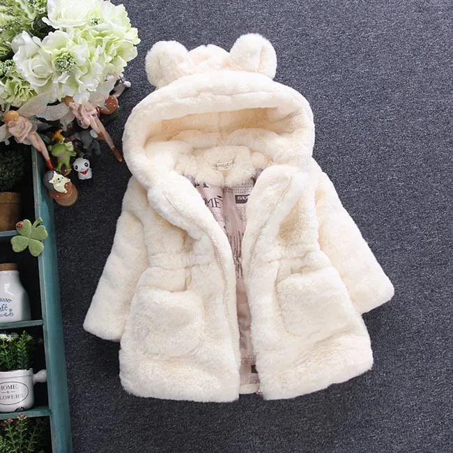 A girl's fur coat for fall and winter 